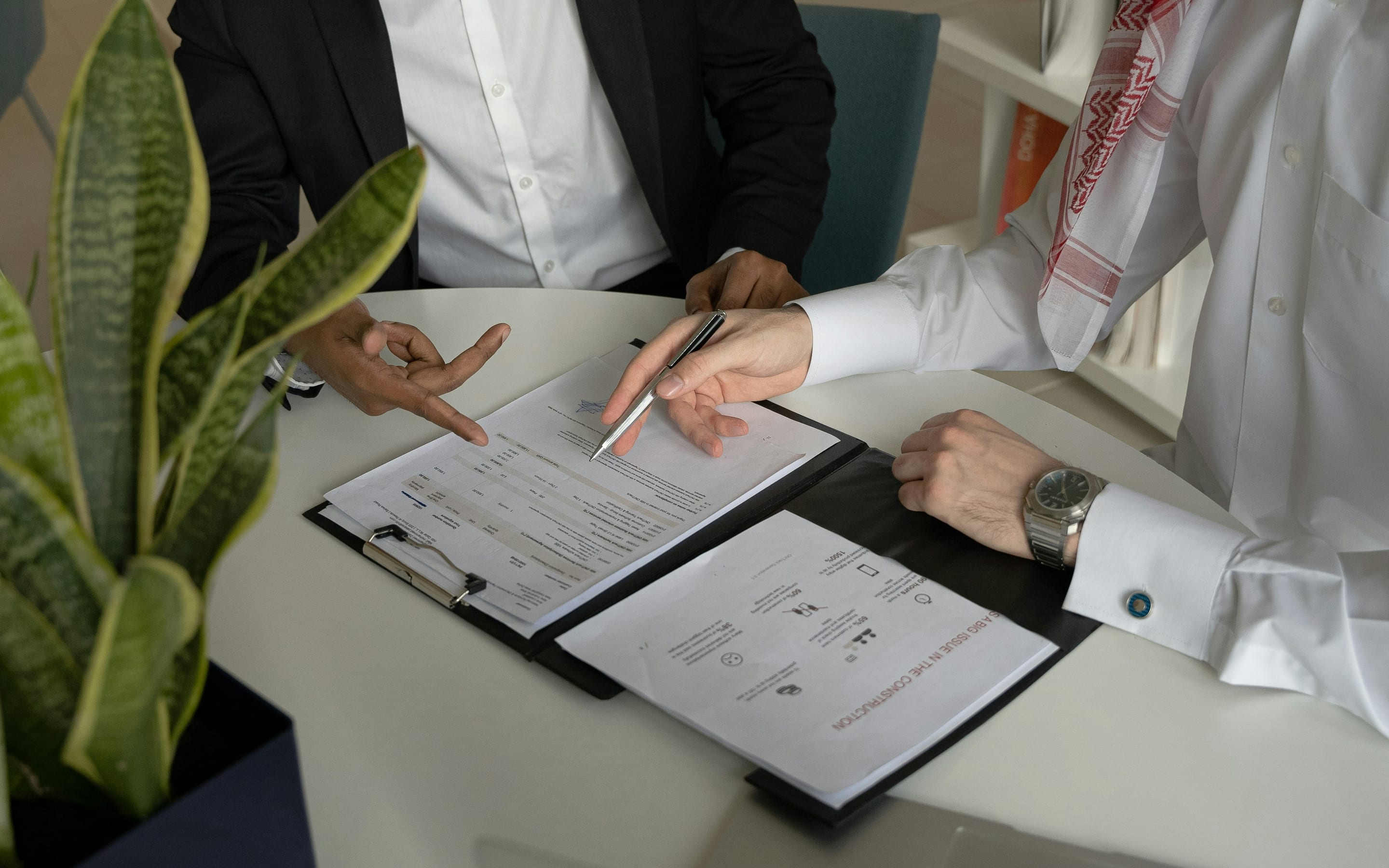 Advisor walking a client through documents for signature